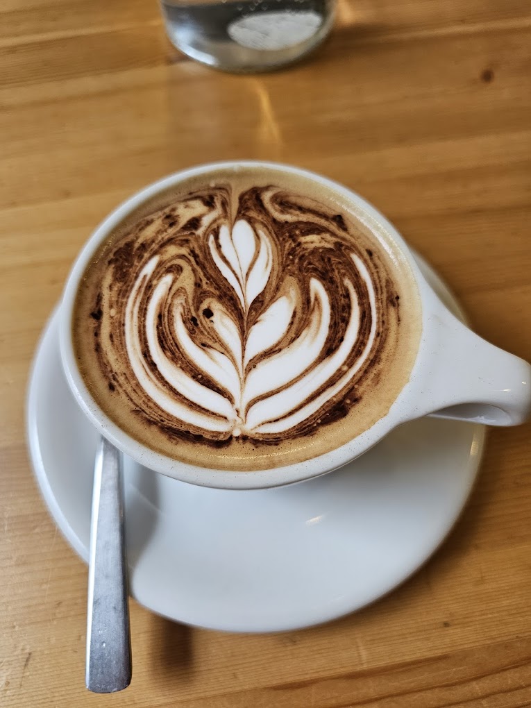 Latte art coffee at The Foliage Cafe North Sydney